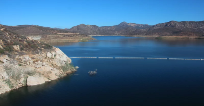 The San Vicente reservoir in San Diego County stores water from as far away as the Colorado River. Pumping water into a smaller reservoir in the surrounding mountains could store excess solar power until it's needed, when the sun sets.